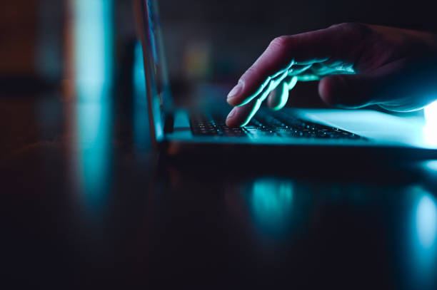 computer with a person typling